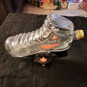 Glass Skate-Shaped Bottle with Maple Leaf Design